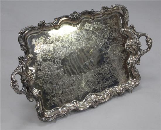 An Edwardian silver plated two handled tea tray, 32in over handles.